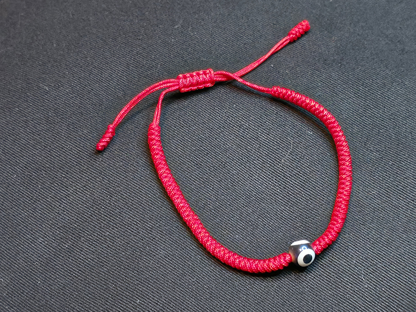 Hand Knotted Nepali Red Cord Evil Eye Bracelet