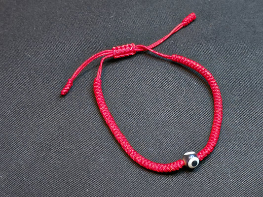 Hand Knotted Nepali Red Cord Evil Eye Bracelet