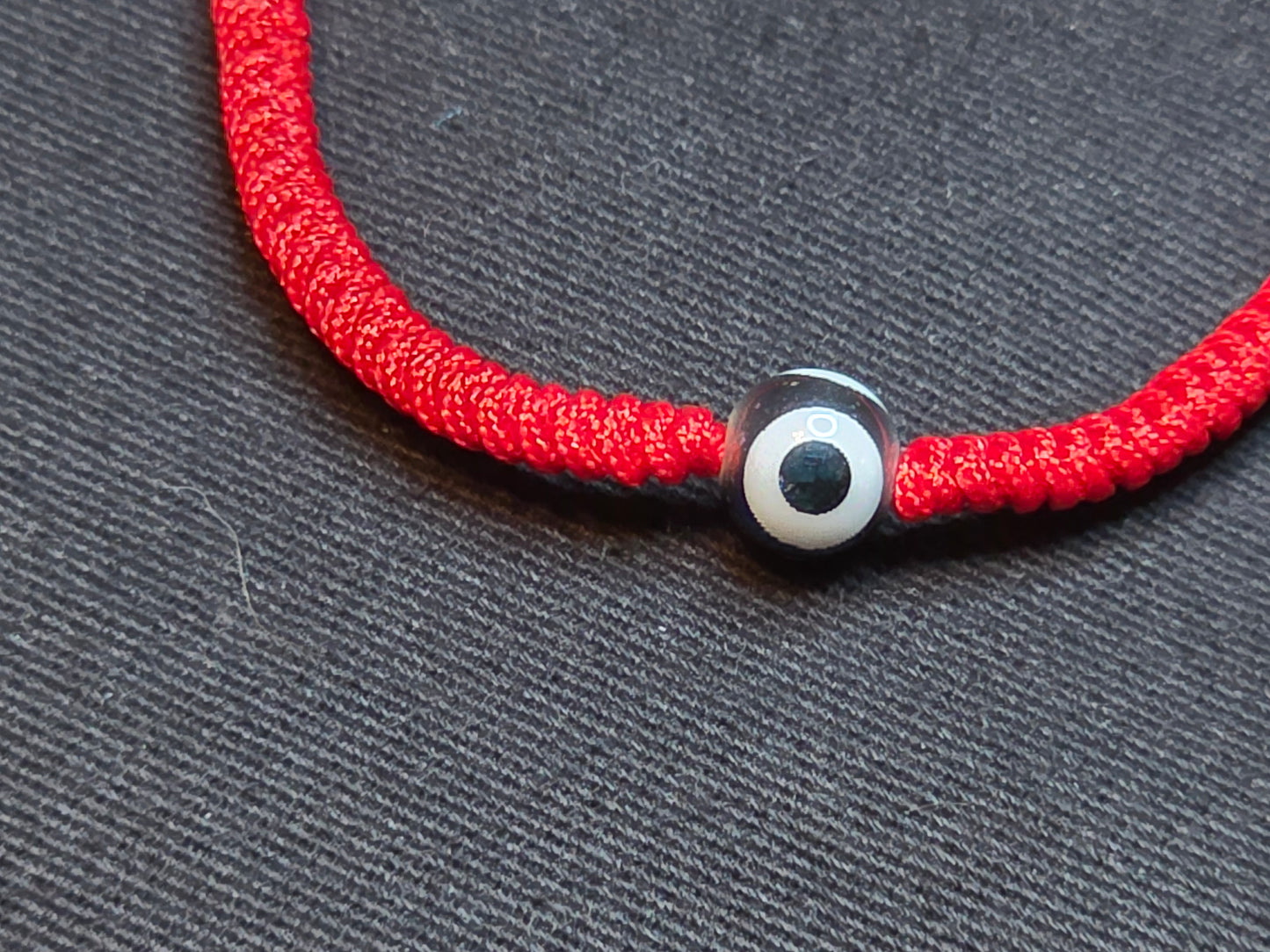 Hand Knotted Nepali Red Cord Evil Eye Bracelet